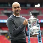 Pep Guardiola with the FA Cup trophy following Manchester City's victory over Watford in the Wembley final of 2019. (Photo by Julian Finney/Getty Images)