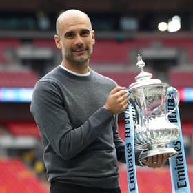 Pep Guardiola with the FA Cup trophy following Manchester City's victory over Watford in the Wembley final of 2019. (Photo by Julian Finney/Getty Images)