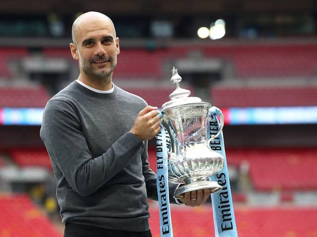 Pep Guardiola with the FA Cup trophy following Manchester City's victory over Watford in the Wembley final of 2019. (Photo by Julian Finney/Getty Images)