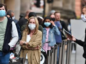 The UK’s Covid-19 alert level has been lowered as the country’s top medics said the threat of the NHS being overwhelmed has receded.