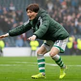 Celtic's Kyogo Furuhashi celebrates with the fans after the win over Rangers.