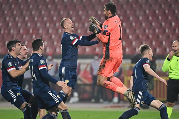 Scotland's players celebrate after winning the Euro 2020 play-off qualification football match between Serbia and Scotland at the Red Star Stadium in Belgrade on November 12, 2020.  (Photo by ANDREJ ISAKOVIC/AFP via Getty Images)