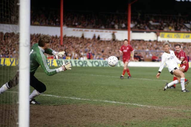 Billy Thomson saves from Willie Miller in the Scottish Cup semi-final at Tynecastle between Dundee United and Aberdeen