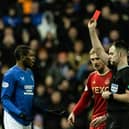 Referee Don Robertson shows Rangers' Dujon Sterling a red card for a tackle on Aberdeen's Jack MacKenzie. (Photo by Craig Williamson / SNS Group)