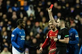 Referee Don Robertson shows Rangers' Dujon Sterling a red card for a tackle on Aberdeen's Jack MacKenzie. (Photo by Craig Williamson / SNS Group)