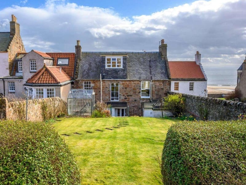 Regularly featuring in lists of Scotland's most exclusive villages, Elie is located in the East Neuk of Fife and has everything you could need for a happy holiday - several pristine beaches, a golf course, water sports and one of the country's best coastal pubs and restaurants in The Ship Inn. Priced at offers over £625,000, this property on South Street is close to the village centre and the much-loved Elie Deli. The end terrace has five bedrooms and three public rooms and is 100m from the beach. Contact Savills for more information.