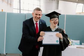 CEO of Capability Scotland Brian Logan celebrates with student Fergus McAlpine on his graduation from Corseford College.