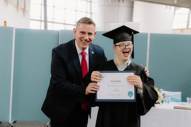 CEO of Capability Scotland Brian Logan celebrates with student Fergus McAlpine on his graduation from Corseford College.