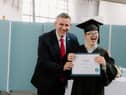 CEO of Capability Scotland Brian Logan celebrates with student Fergus McAlpine on his graduation from Corseford College.