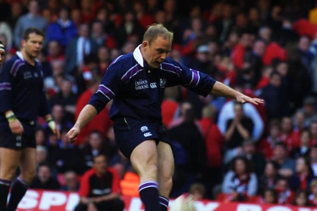 Duncan Hodge of Scotland kicks the ball forward during the Lloyds TSB Six Nations Championship match between Wales and Scotland played at the Millennium Stadium, in Cardiff, Wales, in 2002. Scotland won the match 27-22.