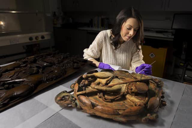 Gemma Frew, conservator at National Museums Scotland, prepares a 17th Century ceiling boss from Linlithgow Palace which is going on loan to Perth Museum's opening exhibition, Unicorn. PIC: Duncan McGlynn/National Museums Scotland.