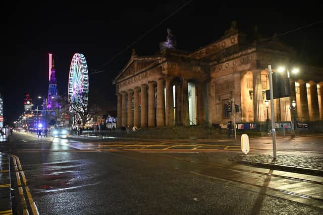 The near deserted Princes Street on Hogmanay after all outdoor events including the street party and fireworks display were cancelled. (Picture: Andy Buchanan/PA)