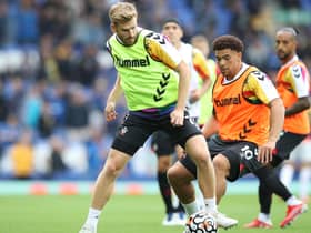 Stuart Armstrong warms up before the match against Everton at Goodison Park on August 14 - his last appearance for Southampton. (Photo by Ian MacNicol/Getty Images)