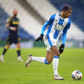 Juninho Bacuna of Huddersfield Town runs with the ball during the Sky Bet Championship match between Huddersfield Town and Stoke City at John Smith's Stadium on January 30, 2021. (Photo by Alex Livesey/Getty Images)