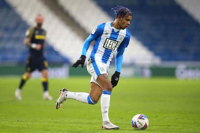 Juninho Bacuna of Huddersfield Town runs with the ball during the Sky Bet Championship match between Huddersfield Town and Stoke City at John Smith's Stadium on January 30, 2021. (Photo by Alex Livesey/Getty Images)