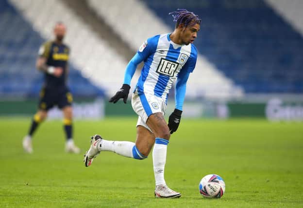 Juninho Bacuna of Huddersfield Town runs with the ball during the Sky Bet Championship match between Huddersfield Town and Stoke City at John Smith's Stadium on January 30, 2021. (Photo by Alex Livesey/Getty Images)