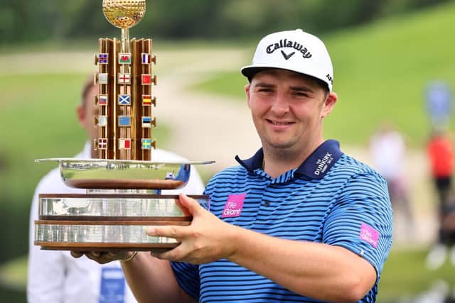 Marcus Armitage poses with the trophy after winning rhe Porsche European Open in Germany. Picture: Christof Koepsel/Getty Images.