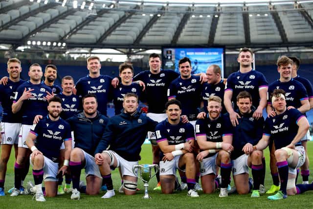 George Turner, front row second from right, and the rest of the Scotland team celebrate the 33-22 win over Italy with the Cuttitta Cup. Photo by Ryan Byrne/INPHO/Shutterstock