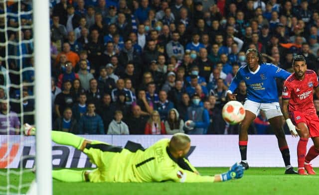Lyon goalkeeper Anthony Lopes saves from Rangers' Joe Aribo during a UEFA Europa League group stage match between Rangers and Lyon, on September 16, 2021, in Glasgow, Scotland.  (Photo by Craig Foy / SNS Group)