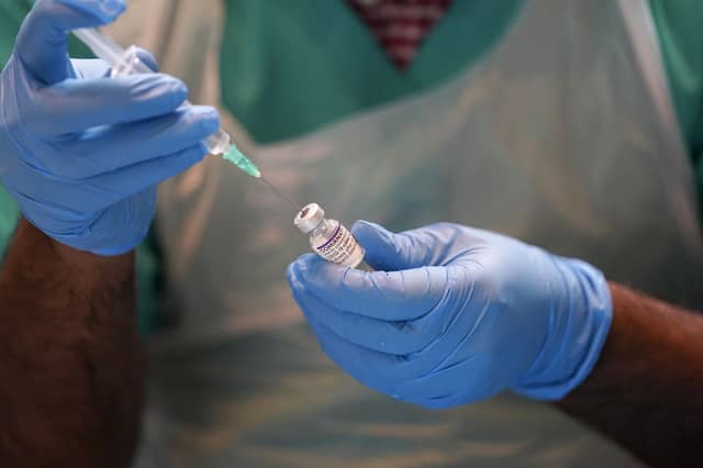 Vaccine passports are to be rolled out in Scotland next month.