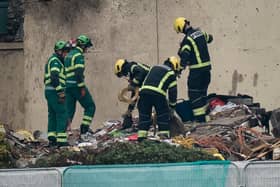 Specialist rescue teams at the scene of an explosion and fire at a block of flats in St Helier, Jersey. At least three people have died and a dozen are missing following the blast. Picture date: Sunday December 11, 2022.