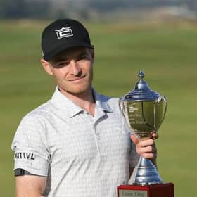 Jack South shows off the trophy after winning The Motocaddy Masters at Leven Links in 2021. Picture: PGA EuroPro Tour.