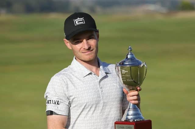 Jack South shows off the trophy after winning The Motocaddy Masters at Leven Links in 2021. Picture: PGA EuroPro Tour.