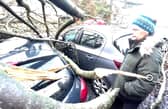 Lesley Kerr, 62, standing next to her car which was damaged by a fallen tree during Storm Isha on Sunday evening (pic: Lisa Ferguson)