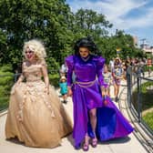 Drag queens Brigitte Bandit and Tequila Rose lead a pride parade march last year in Texas.