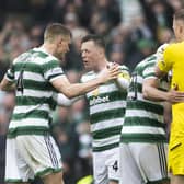 Callum McGregor celebrates Celtic's 1-0 win over Rangers with his team-mates.