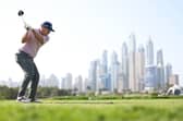 Richie Ramsay tees off on the eighth hole during round one of the Hero Dubai Desert Classic at Emirates Golf Club. Picture: Richard Heathcote/Getty Images.