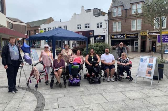 Community Councillors and members of the public along with Josh Mennie from Karen Adams office get set to tackle the town centre.