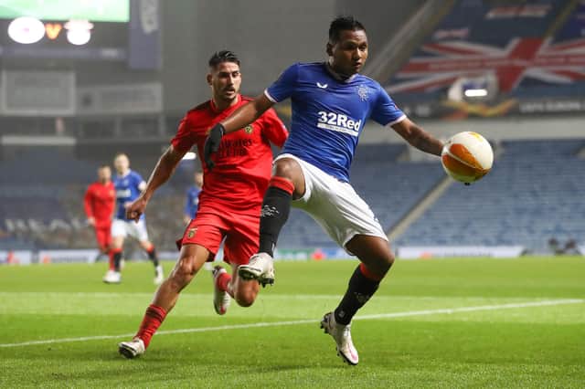 Rangers' Colombian striker Alfredo Morelos (R) contols the ball during the UEFA Europa League 1st round Group D football match between Rangers and Benfica at the Ibrox Stadium in Glasgow on November 26, 2020. (Photo by RUSSELL CHEYNE / POOL / AFP) (Photo by RUSSELL CHEYNE/POOL/AFP via Getty Images)