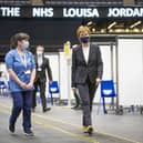 First Minister of Scotland Nicola Sturgeon after receiving the first shot of the Astra Zeneca vaccine, administered by staff nurse Elaine Anderson, at the NHS Louisa Jordan vaccine centre in the SSE Hydro in Glasgow, Scotland. Picture date: Thursday April 15, 2021.