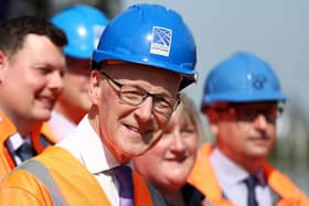 First Minister John Swinney during a visit to meet project leads and apprentices working on the Levenmouth Rail Link at Cameron Bridge station in Fife on Friday. Photo: Jeff J Mitchell/PA Wire