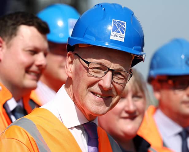 First Minister John Swinney during a visit to meet project leads and apprentices working on the Levenmouth Rail Link at Cameron Bridge station in Fife on Friday. Photo: Jeff J Mitchell/PA Wire
