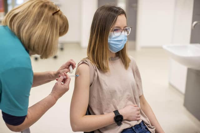 Authorities have urged eligible people to take up the offer of a flu vaccine. Picture: PA