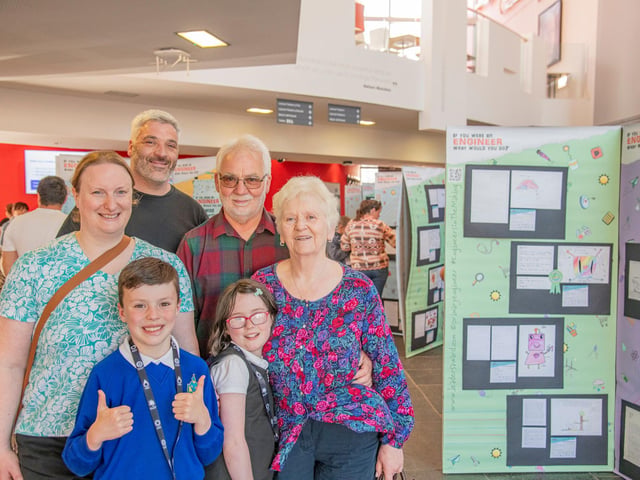 Proud family members looking around at the exhibition