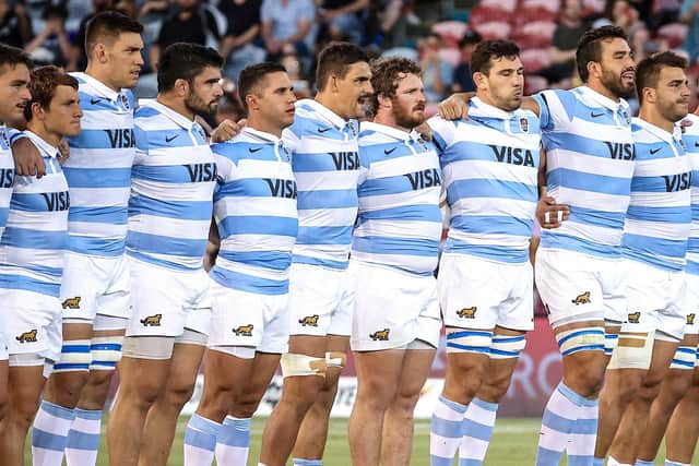 Argentina captain Pablo Matera stands with his team-mates as they watch the New Zealand players perform the Haka.