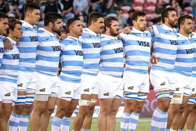 Argentina captain Pablo Matera stands with his team-mates as they watch the New Zealand players perform the Haka.