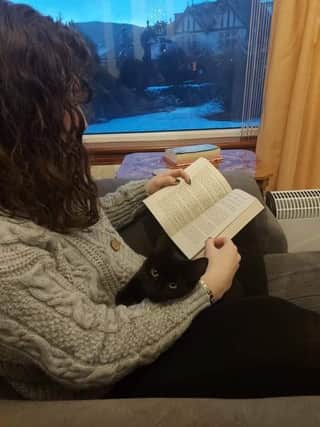 Here's me reading The Song of Achilles by Madeline Miller (which is well worth reading) with my cat Luna.