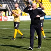 Livingston manager David Martindale leads the celebrations after the win over Hibs.