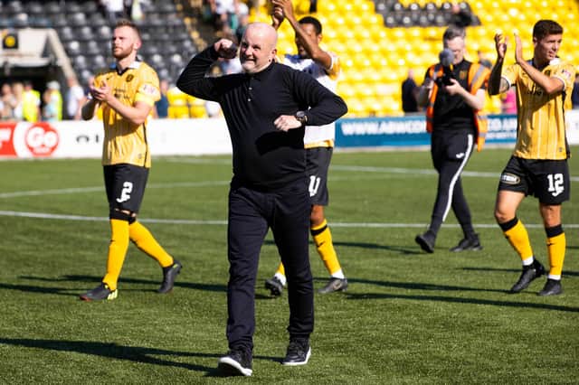 Livingston manager David Martindale leads the celebrations after the win over Hibs.
