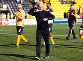 Livingston manager David Martindale leads the celebrations after the win over Hibs.