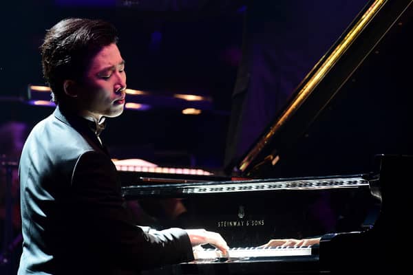 Pianist Ji Liu plays Rachmaninov's Piano Concerto No.2 with the Liverpool Philharmonic Orchestra during Classic FM Live at the Royal Albert Hall, London, in 2015. Photo: Ian West/PA Wire