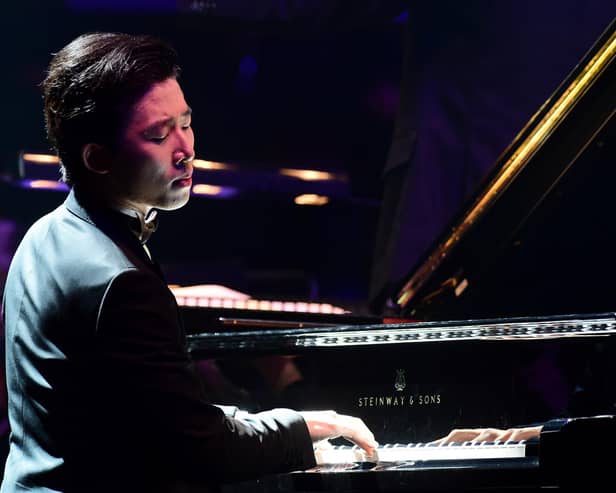 Pianist Ji Liu plays Rachmaninov's Piano Concerto No.2 with the Liverpool Philharmonic Orchestra during Classic FM Live at the Royal Albert Hall, London, in 2015. Photo: Ian West/PA Wire