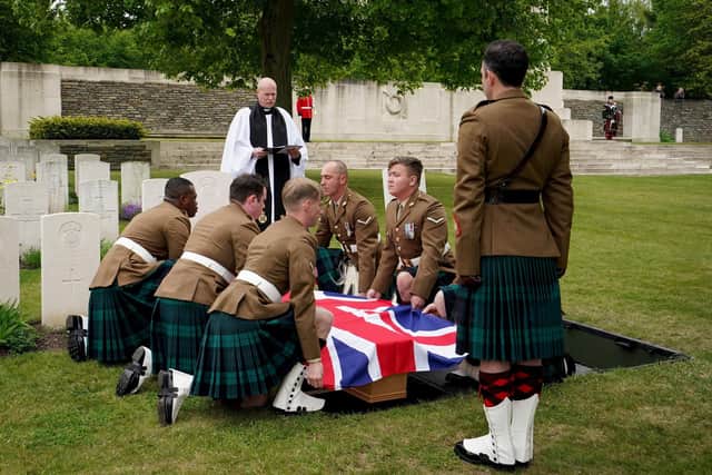 A bearer party from the Royal Regiment of Scotland carry the coffin of Private William Johnston, 7th Battalion, Royal Scots Fusiliers as he is buried with full military honours.
