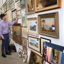 Some of the 200 paintings that covered the walls of the farmhouse.
