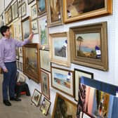Some of the 200 paintings that covered the walls of the farmhouse.