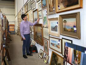 Some of the 200 paintings that covered the walls of the farmhouse.